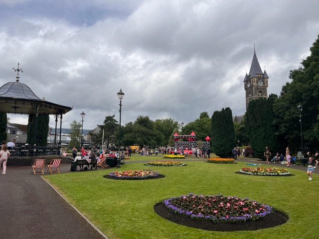 Victoria Gardens, deck chairs, clouds, band stand, people